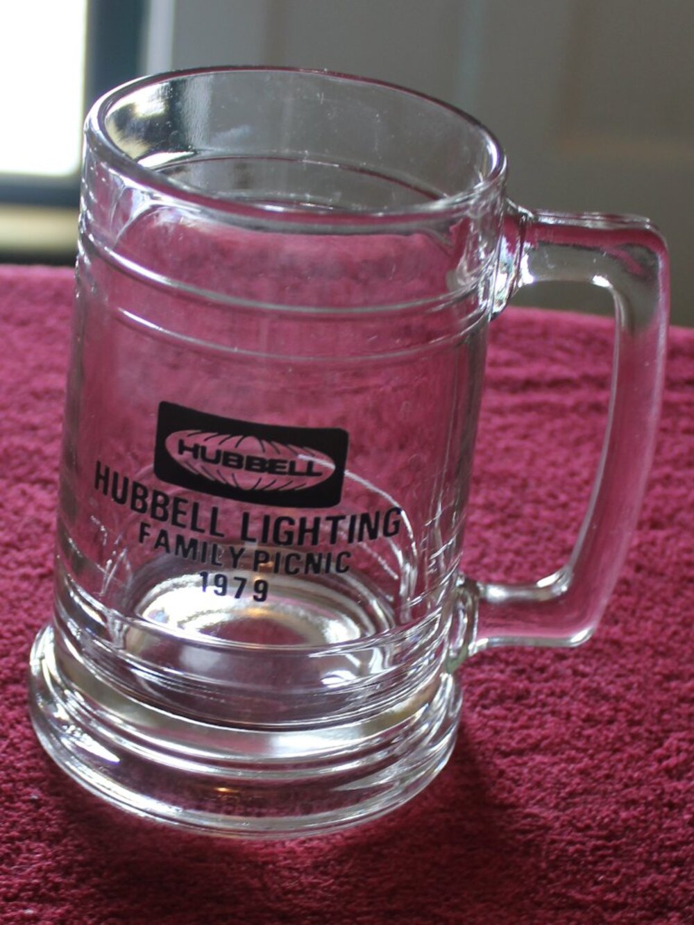 Vintage clear glass beer mug featuring "Hubbell Lighting Family Picnic 1979"
